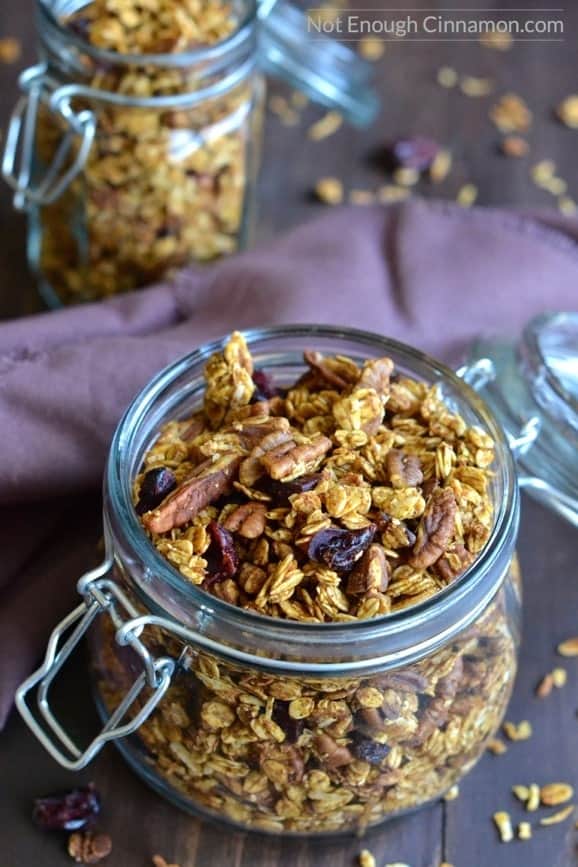 close-up of an open jar filled to the top with homemade easy pumpkin granola 