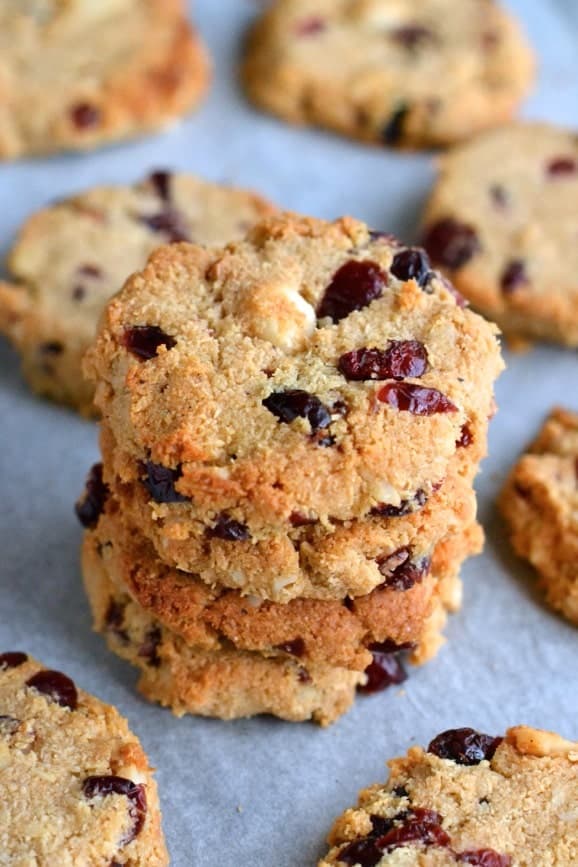 a stack of Paleo Macadamia Cranberries Cookies on a parchment-paper line baking tray