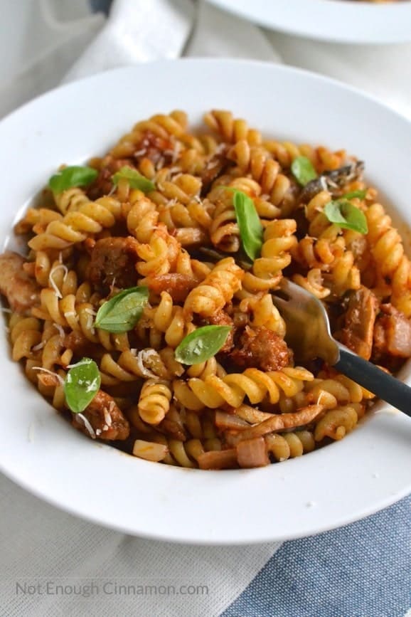 close-up of a bowl with Italian Sausage Pasta sauce tossed with fusilli noodles