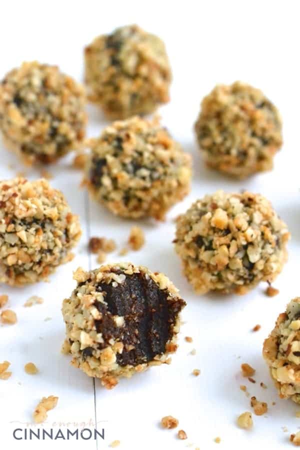 Clean Eating Cacao & Hazelnut Healthy Energy Balls on a white tabletop 