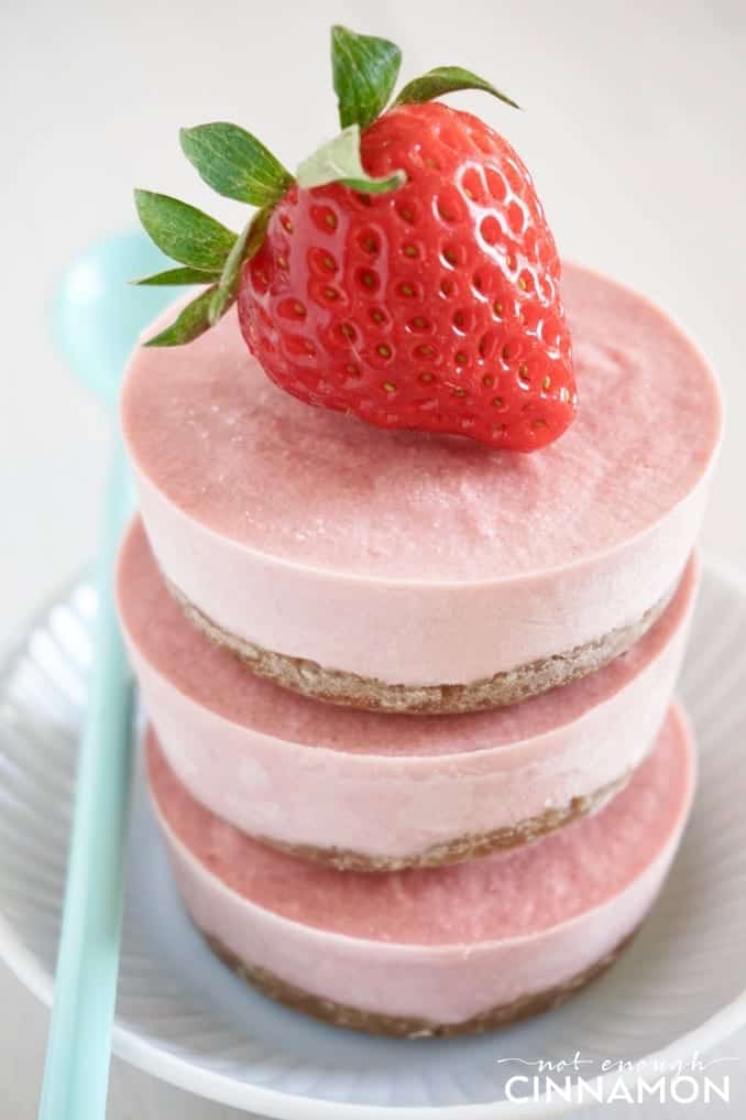 side view of a stack of No Bake Vegan Strawberry Mini Cheesecakes 