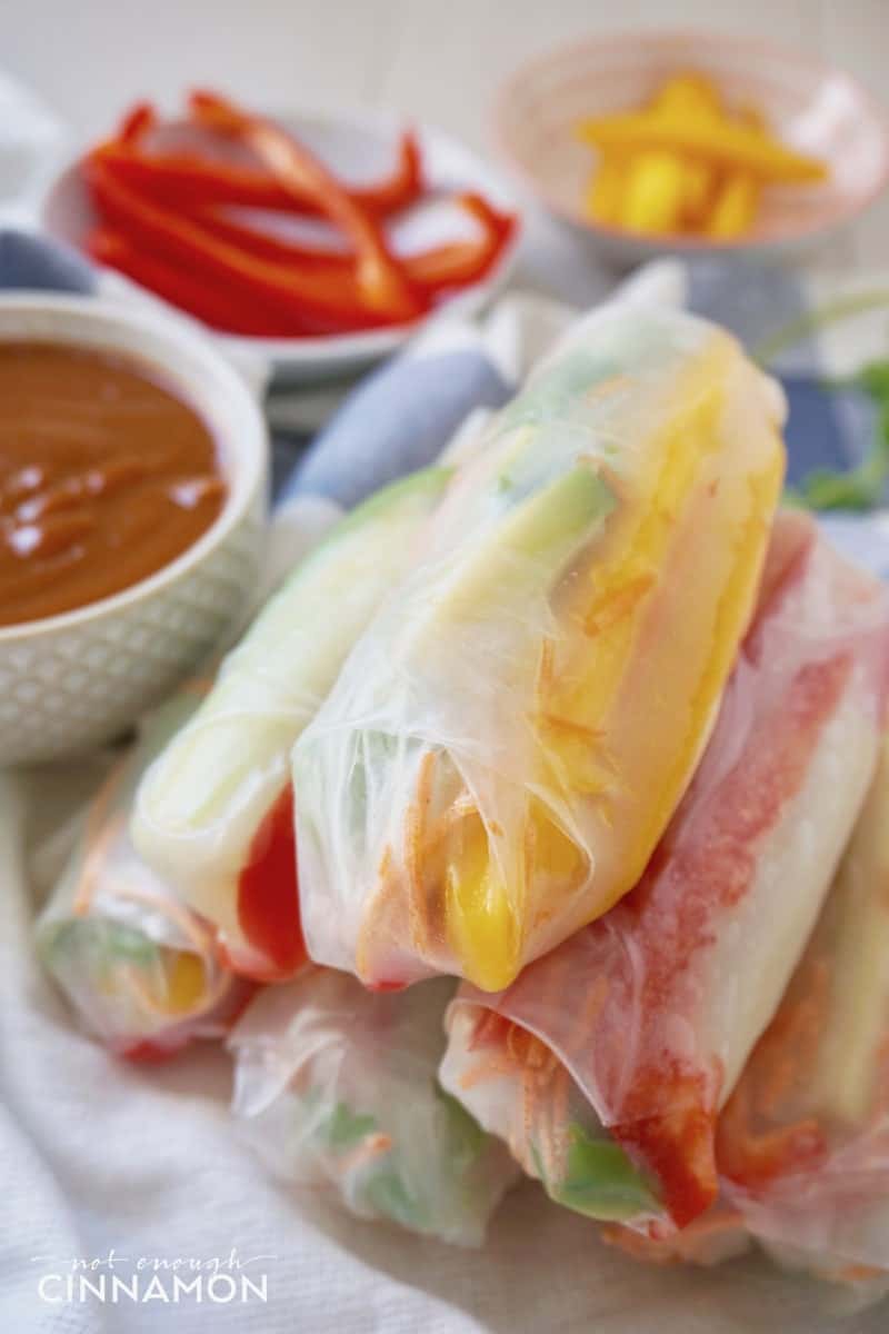 close-up of a stack of Vegan Mango and Avocado Summer Rolls with Peanut Sauce 