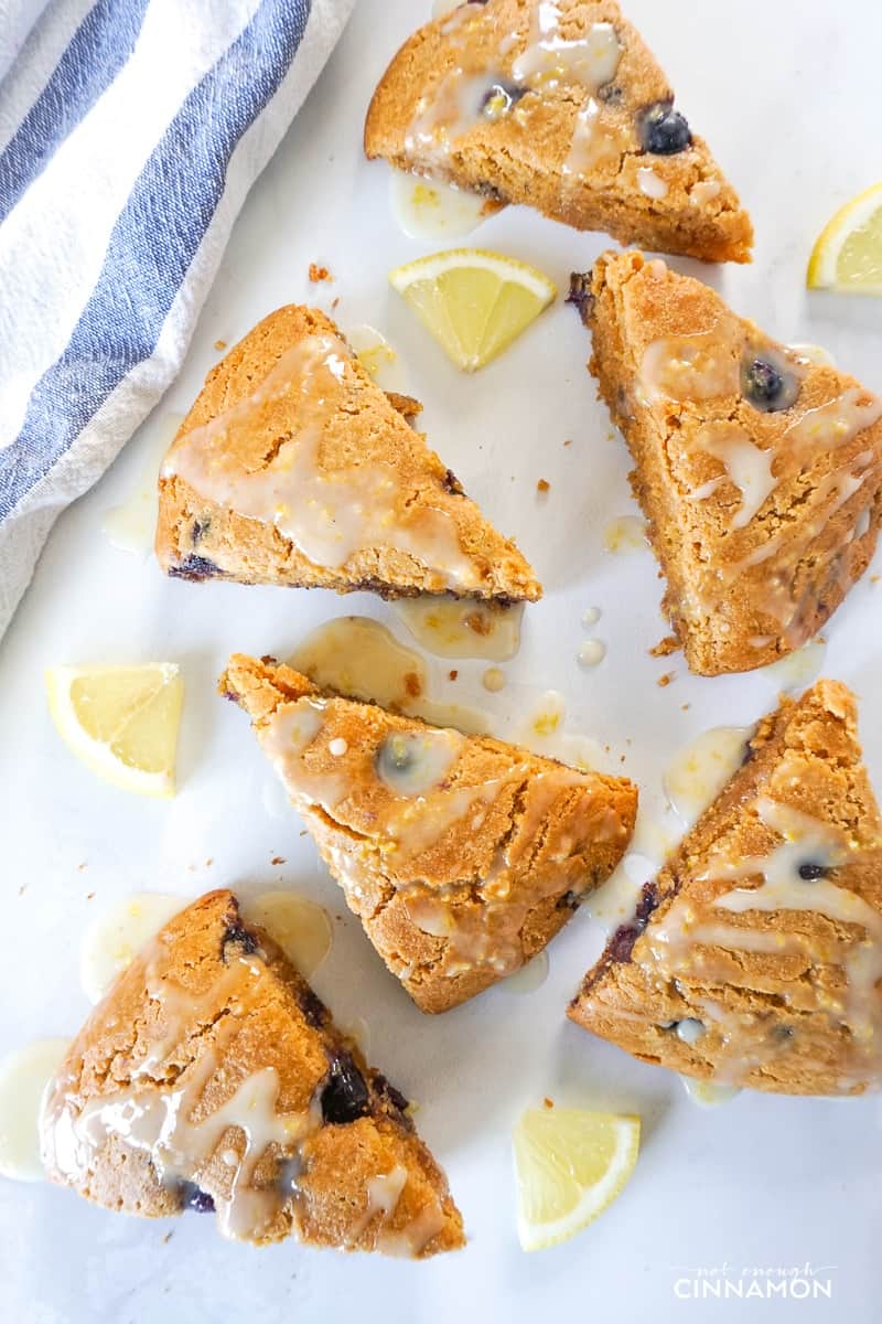 overhead shot of almond flour lemon blueberry scones topped with lemon glaze