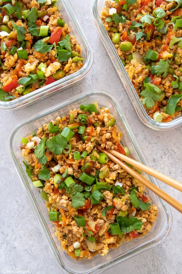 overhead shot of three meal prep containers with Asian Healthy Fried Rice with ground turkey
