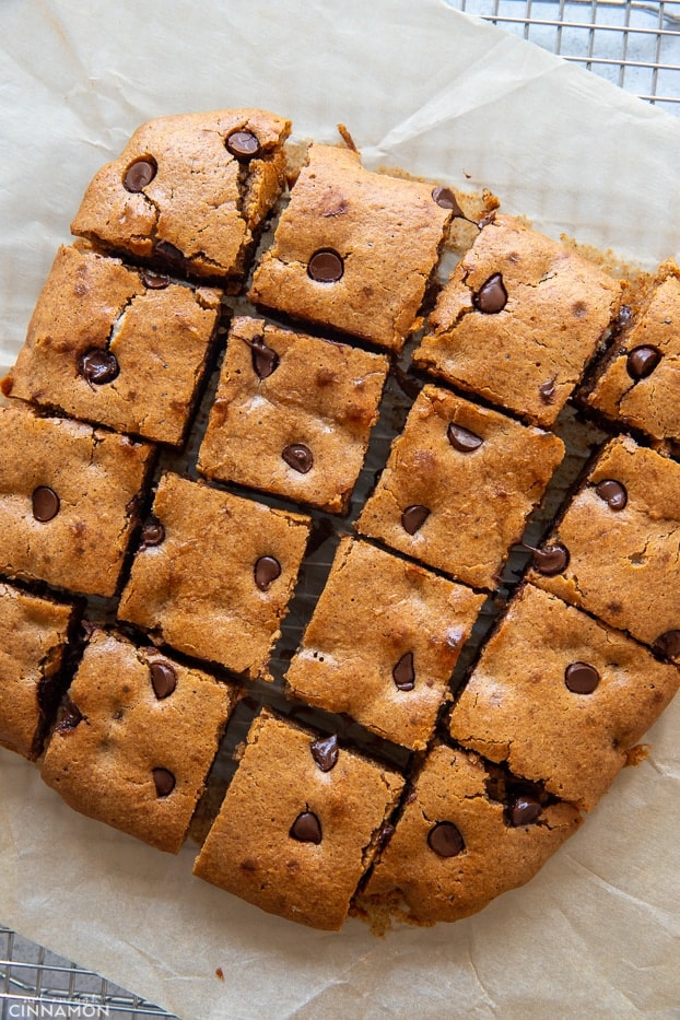 overhead shot of paleo almond butter blondies with chocolate chips cut into squares