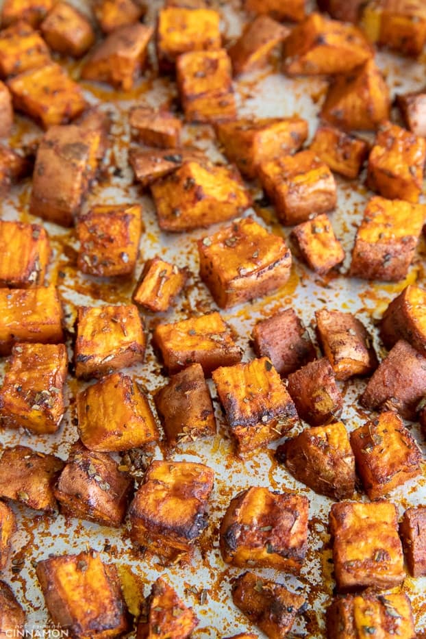 roasted sweet potato cubes on a sheet pan 