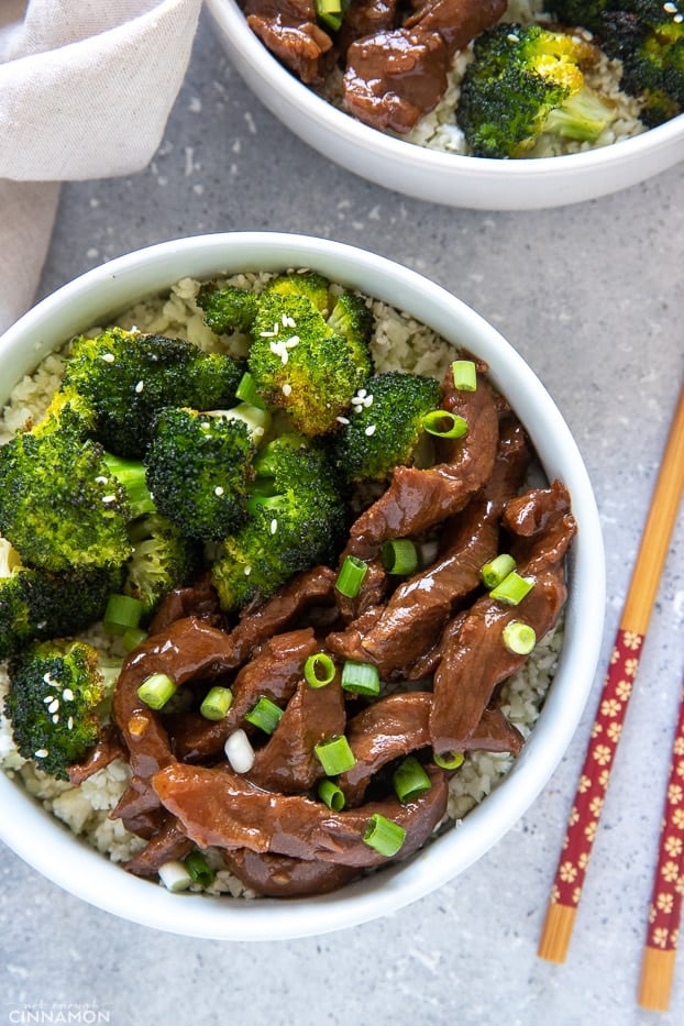 overhead shot of paleo slow cooker Mongolian Beef and Broccoli served over cauliflower rice