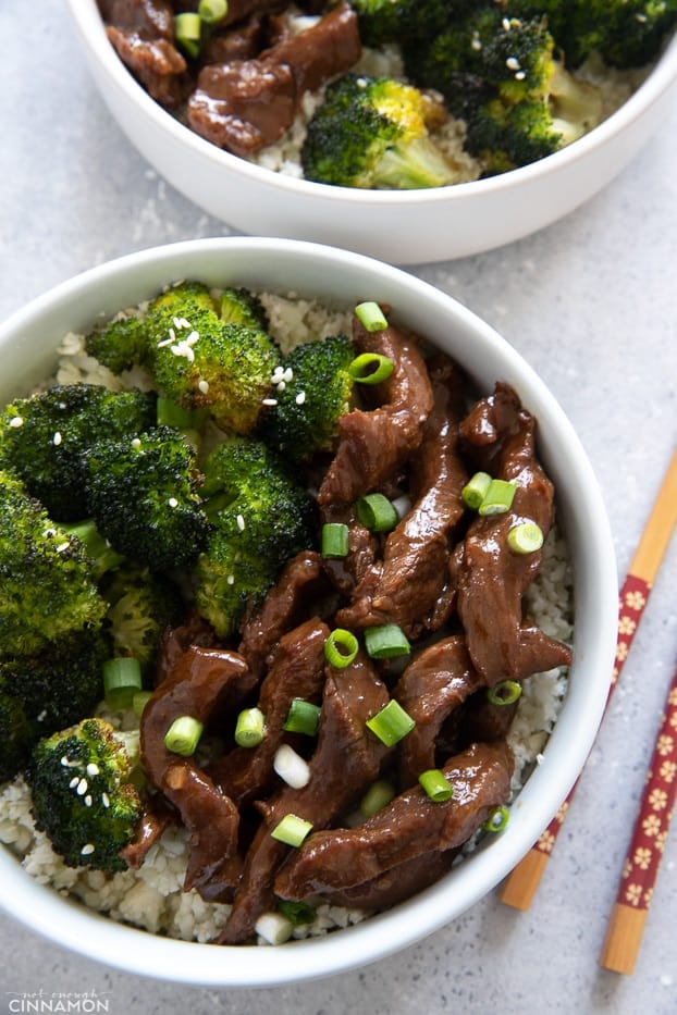 Pf Changs Paleo Mongolian beef served with roasted broccoli with chopsticks on the side