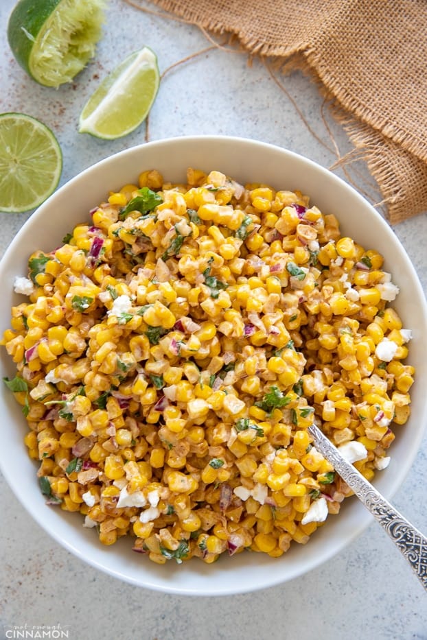 overhead shot of a bowl of healthy Mexican Street Corn Salad tossed with creamy Greek yogurt dressing