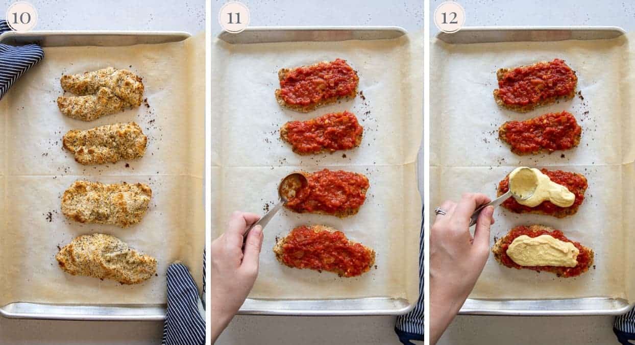 healthy chicken parmesan being baked on a sheet pan and coated with Marinara and cashew cheese sauce