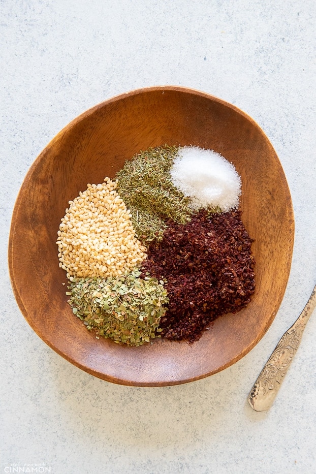 overhead shot of a bowl filled with ingredients for making za'atar
