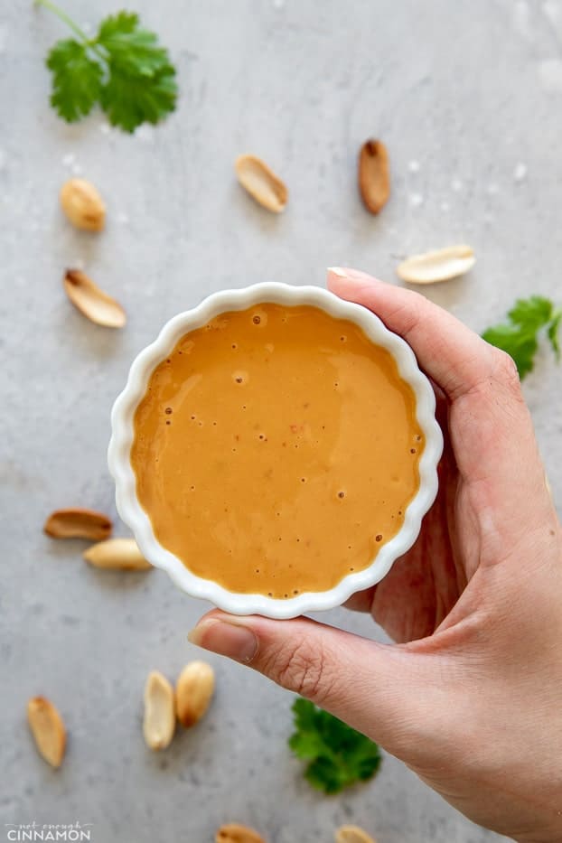 a small bowl with Thai peanut sauce 