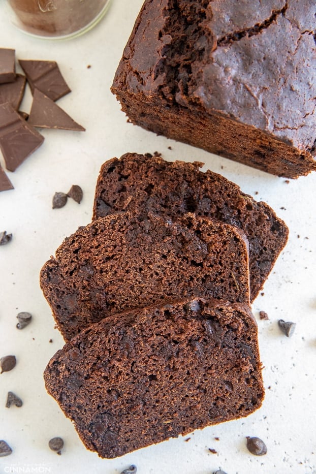 overhead shot of three slices of moist gluten-free chocolate zucchini bread with chocolate chips 