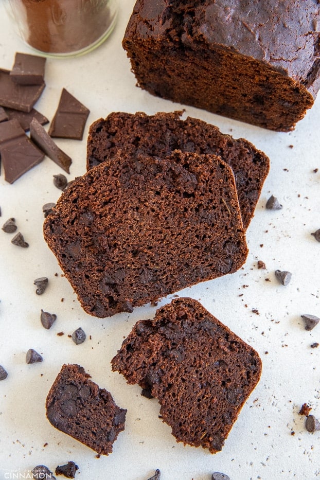 a sliced loaf of gluten-free double chocolate zucchini bread with chocolate chips 