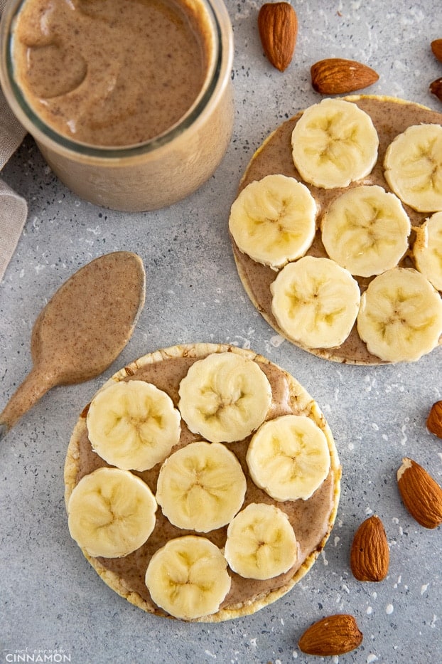 overhead shot of rice wafers topped with almond butter and banana slices 