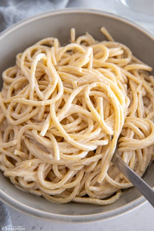 overhead shot of a bowl of creamy vegan tahini pasta 