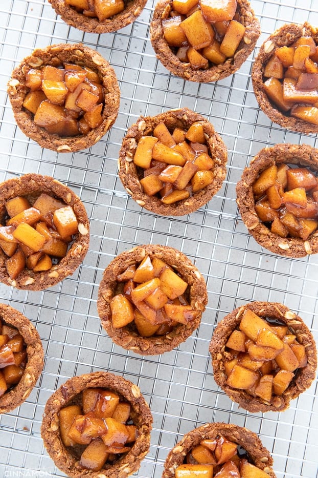 healthy homemade apple crisp cookie cups cooling on a cooling rack