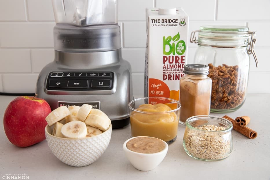 ingredients used for making apple pie smoothie bowls on a kitchen counter 