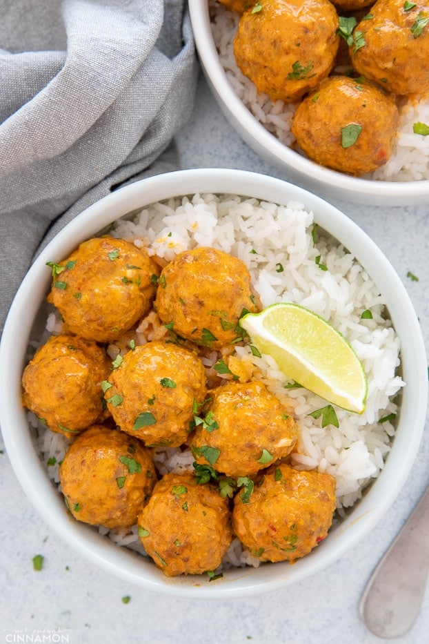 a plate with Thai coconut turkey meatballs curry served with rice