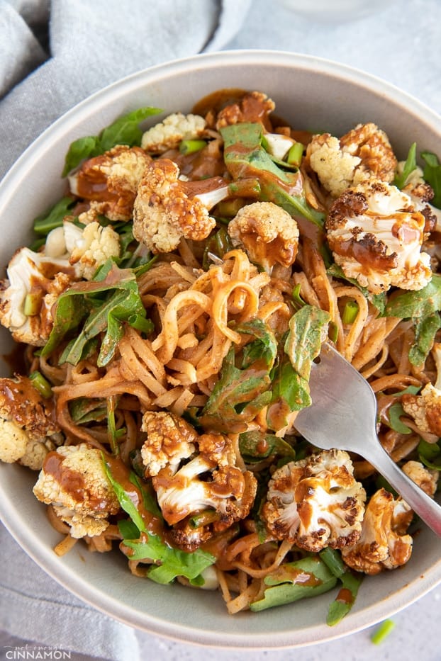 overhead shot of a Almond Butter Noodle Bowl with Cauliflower and Arugula