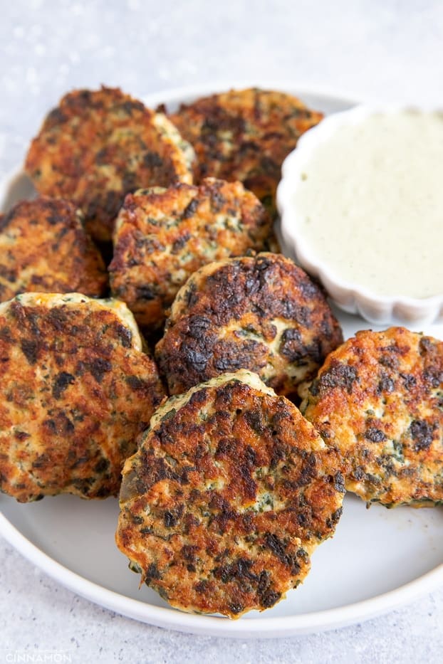 healthy paleo Ranch Chicken Poppers assembled around a small dish with paleo Ranch dip 