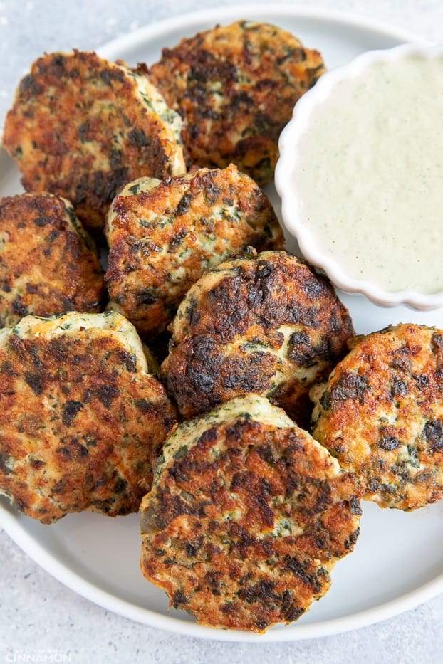 paleo ranch chicken poppers on a plate served with paleo Ranch dip