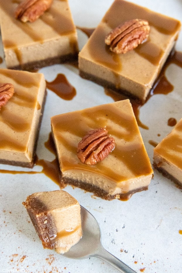 overhead shot of vegan chai latte cheesecake bars drizzled with coconut caramel 