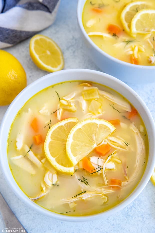 a bowl with Greek Lemon Soup with chicken and carrots added to it