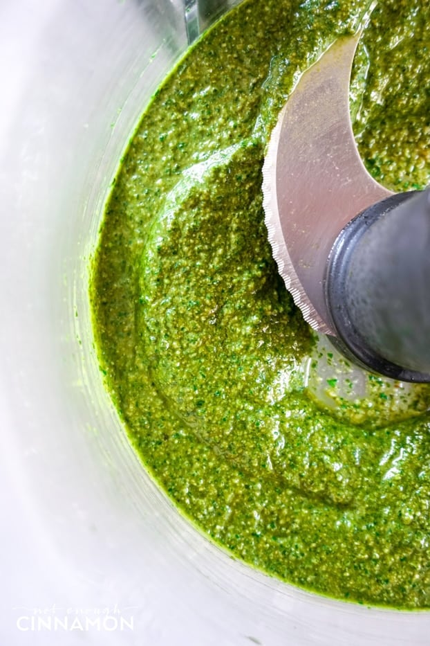 Homemade basil pesto in a food processor