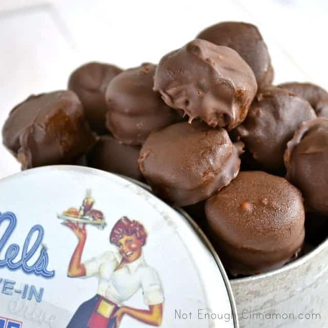 A stack of frozen chocolate peanut butter bites in a metal tin