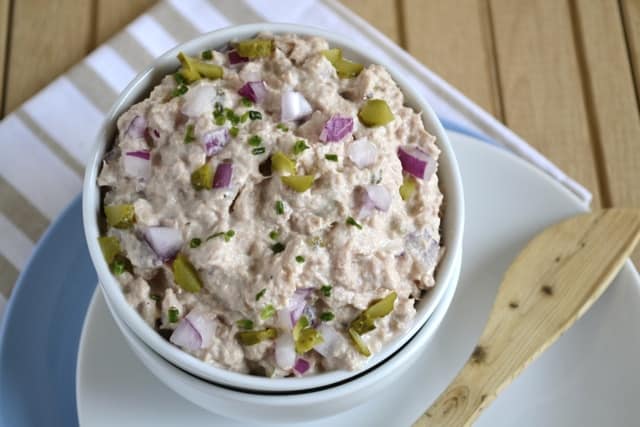 Skinny Tuna Spread served in a little white bowl with a wooden spoon on the side