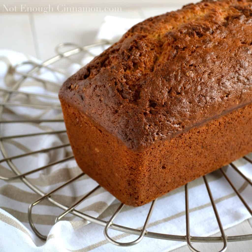 a golden brown loaf of freshly baked Best Banana Bread cooling on a rack