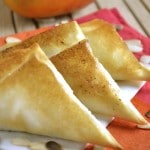 Baked Mango Samosas with toasted almonds served on pink and orange napkins