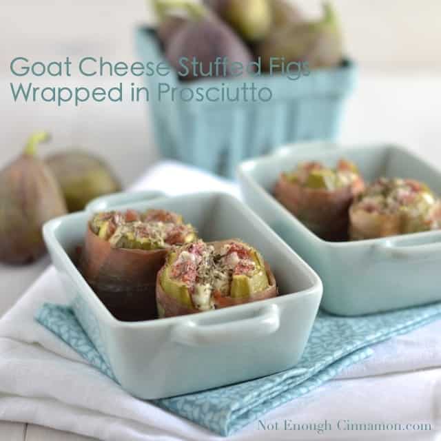 Goat Cheese Stuffed Figs wrapped in prosciutto served in a little white ramekin with some fresh figs in the background
