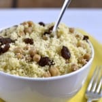 Couscous with Chickpeas and Raisins served in a white bowl