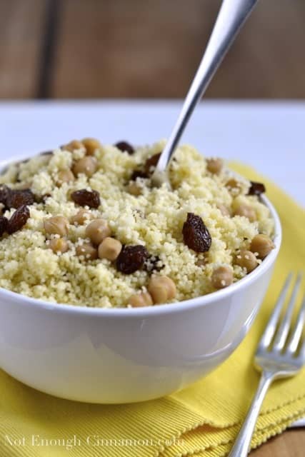 Couscous with Chickpeas and Raisins served in a white bowl