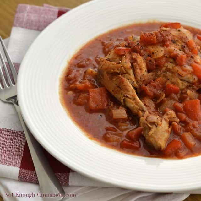 Poulet Basquaise (Pepper and Tomato Chicken Stew) served on a white soup plate