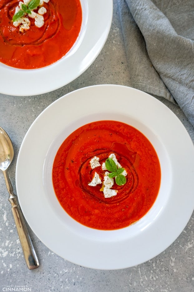 Overhead of two plates of bell pepper soup