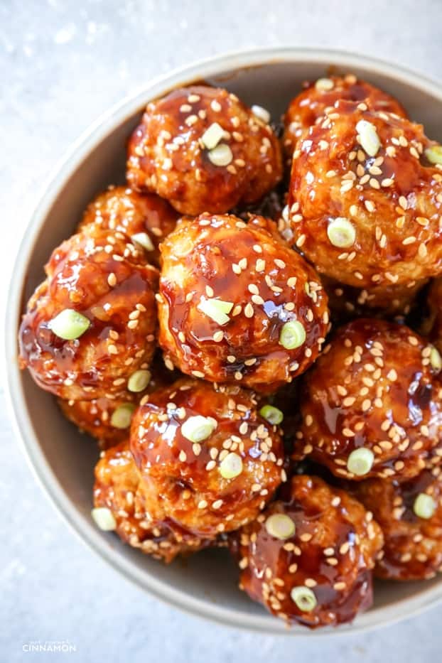 Asian glazed chicken meatballs in a bowl.