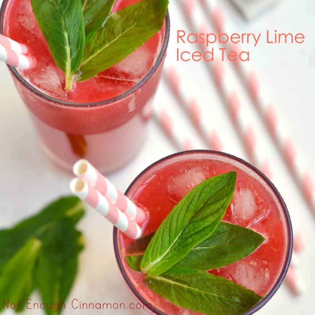 Lime Raspberry Iced Tea served in 2 tall glasses with straws and some fresh mint on top