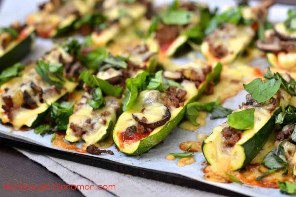 Cheesy Beef and Mushroom Stuffed Zucchini Boats on a baking tray fresh out of the oven