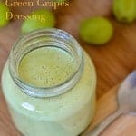 Skinny Dressing with Green Grapes in a mason jar with some seedless grapes in the background