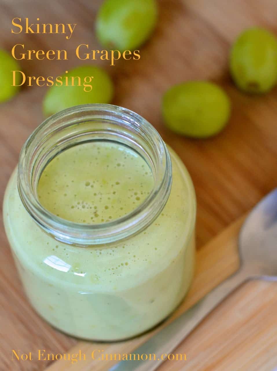Skinny Dressing with Green Grapes in a mason jar with some seedless grapes in the background