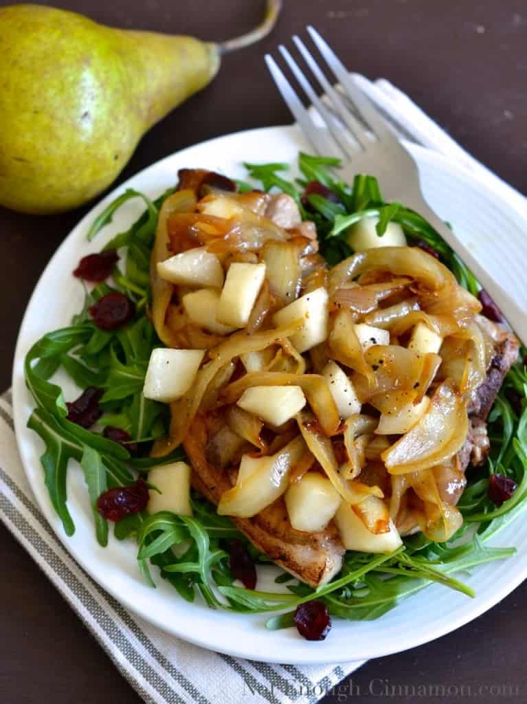 Pan-Seared Pork Chops topped with Pears and Caramelized Onions , served on a bed of arugula