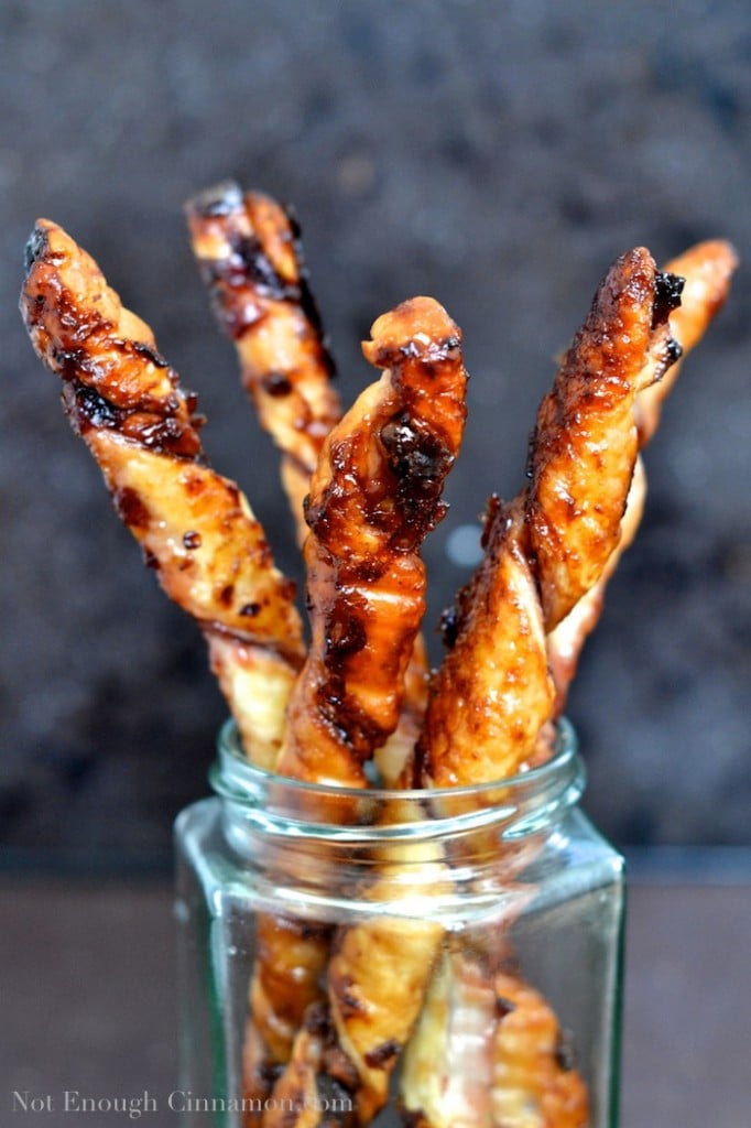 Cherry Pistachio Puff Pastry Twists arranged in a jam jar 