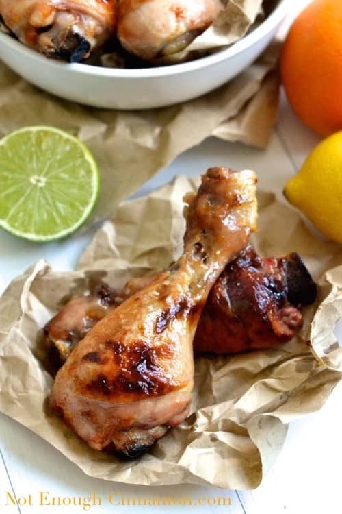 Citrus Marinated Chicken Drumsticks served on a crinkled piece of parchment paper