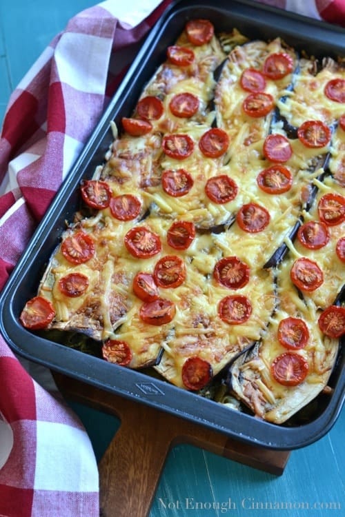 Eggplant and Pesto Baked Pasta  served in a metal casserole dish on a chequered dish towel