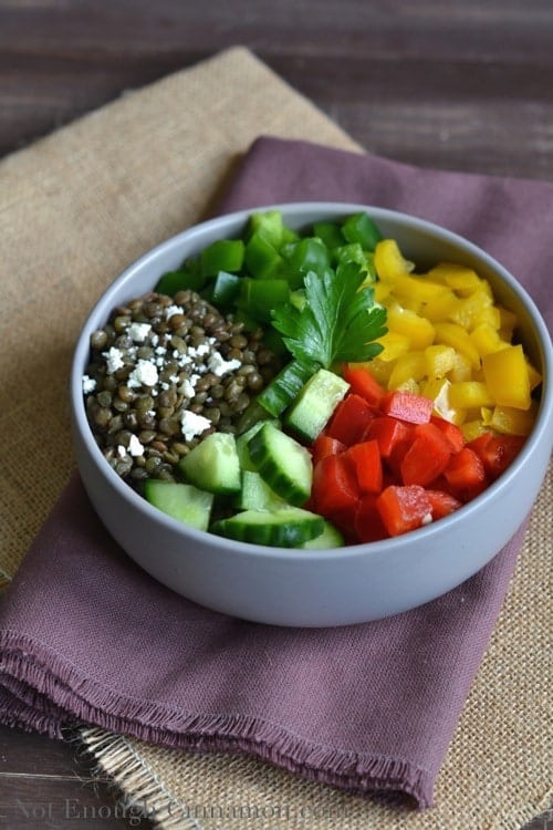 Ingredients for Easy Lentil Bell Pepper Salad neatly arranged in a grey salad bowl ready to be tossed