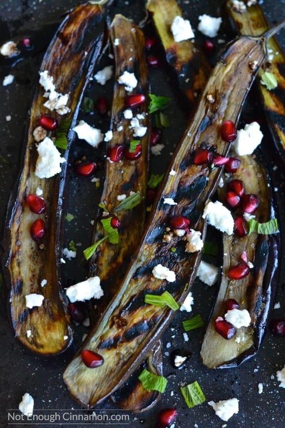 A side dish or appetizer bursting with flavors. You will go for seconds! Naturally gluten free - Grilled Eggplant with Pomegranate and Feta - NotEnoughCinnamon.com