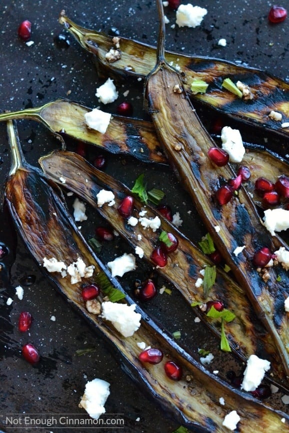A side dish or appetizer bursting with flavors. You will go for seconds! Naturally gluten free - Grilled Eggplant with Pomegranate and Feta - NotEnoughCinnamon.com